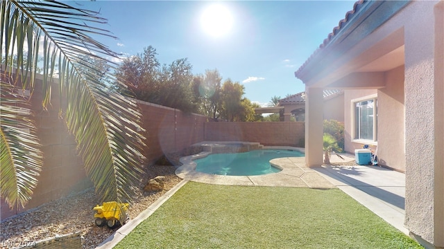 view of pool featuring a patio and a lawn