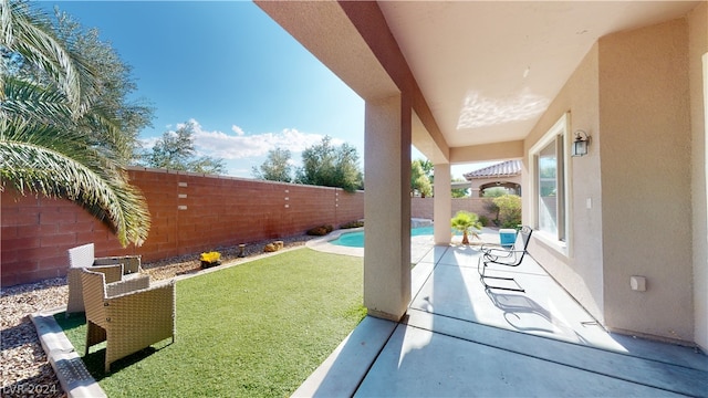 view of patio / terrace featuring a fenced in pool