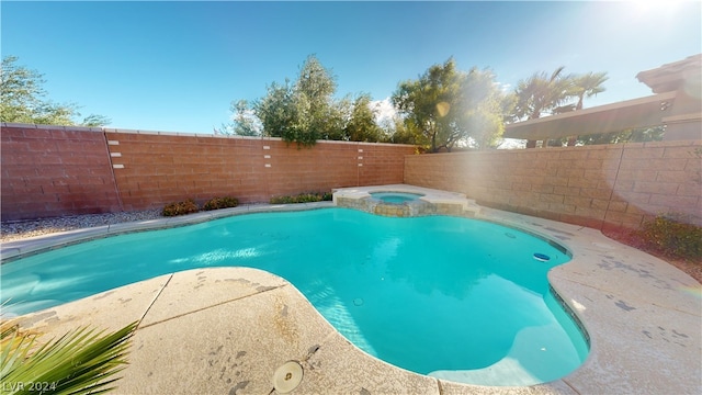 view of pool featuring an in ground hot tub