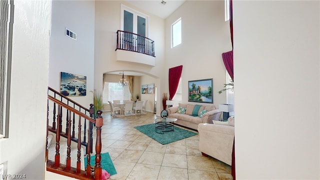 living room featuring a chandelier and light tile patterned floors