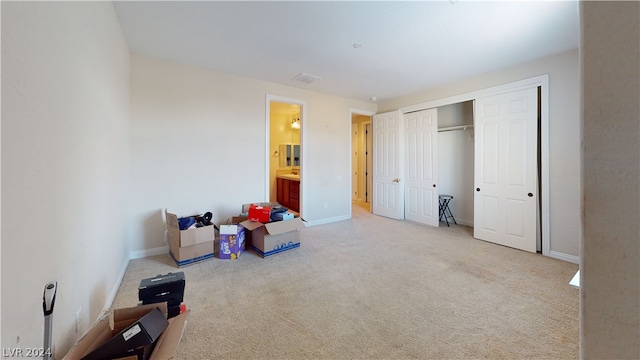 bedroom with a closet and carpet flooring