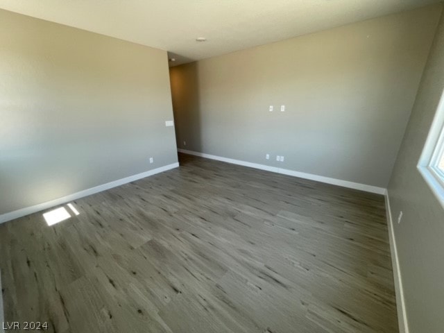 spare room with hardwood / wood-style floors