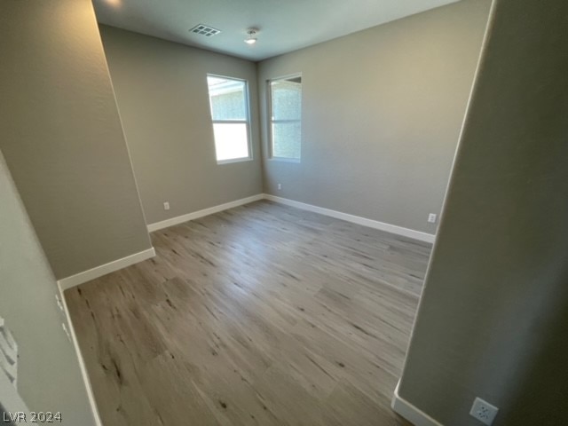 spare room featuring hardwood / wood-style floors