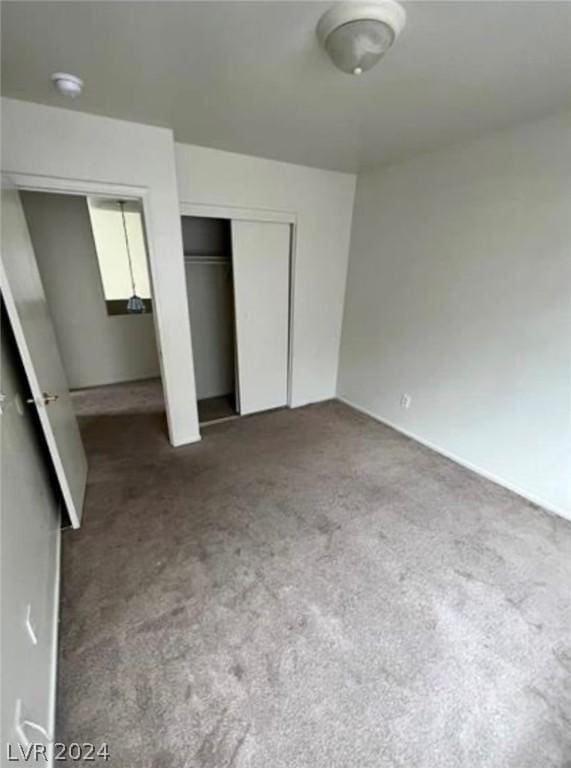 unfurnished bedroom with carpet floors