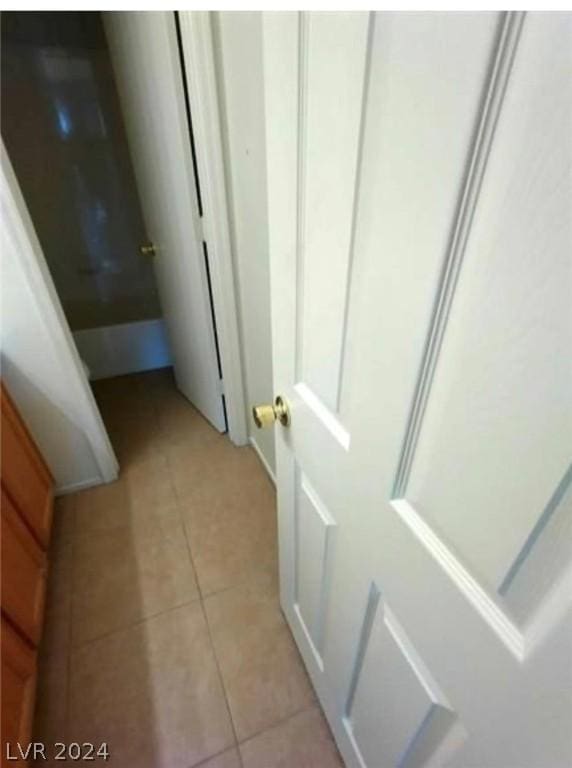 bathroom with tile patterned floors