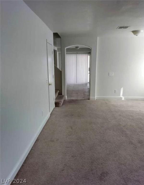 spare room featuring carpet floors