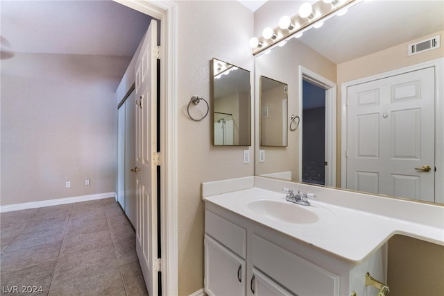 bathroom with vanity and tile patterned floors