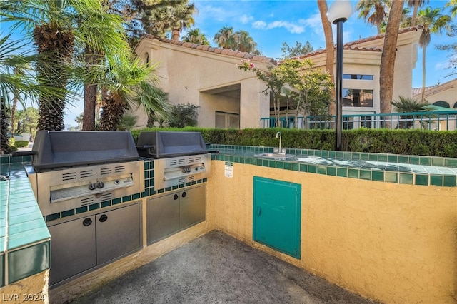 view of patio / terrace with sink, grilling area, and area for grilling