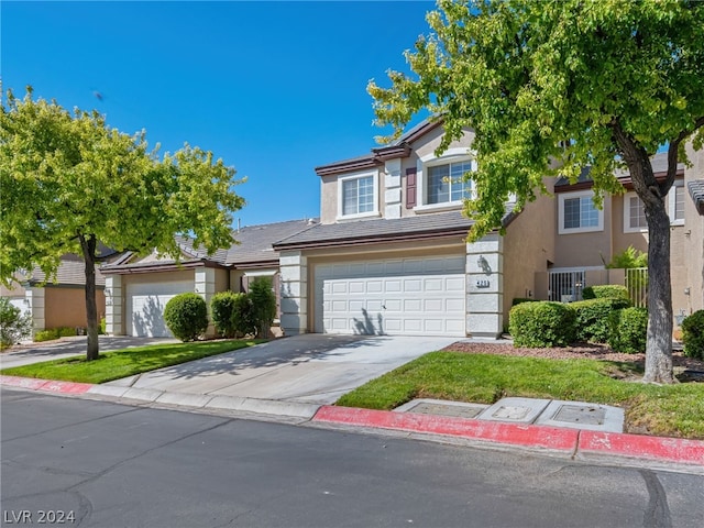 view of front of home with a garage