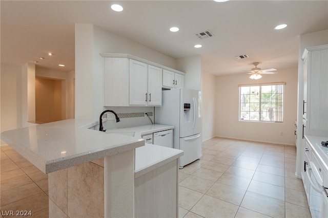 kitchen featuring white appliances, kitchen peninsula, sink, ceiling fan, and white cabinetry