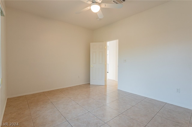 unfurnished room featuring ceiling fan and light tile patterned flooring