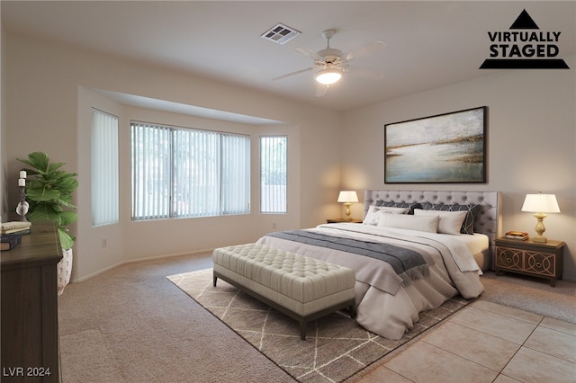 bedroom with ceiling fan and light colored carpet