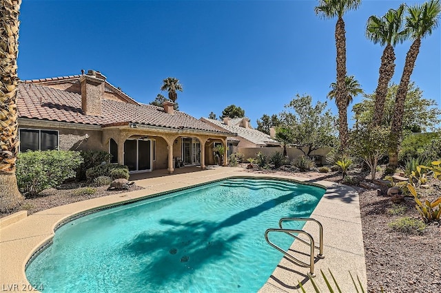 view of pool featuring a patio area