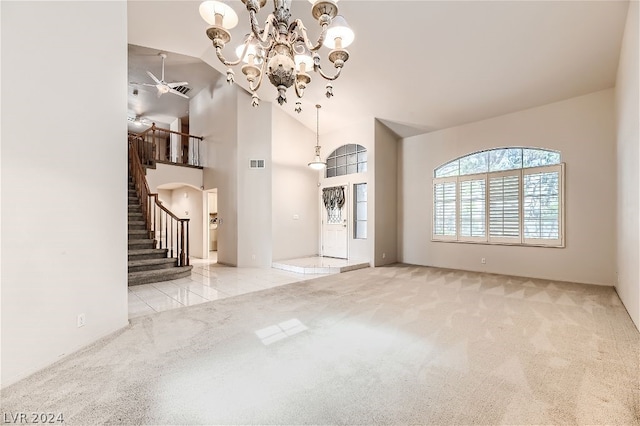 unfurnished living room with light colored carpet and high vaulted ceiling