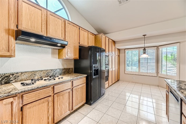 kitchen featuring lofted ceiling, black fridge with ice dispenser, white gas cooktop, hanging light fixtures, and light stone countertops