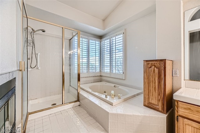 bathroom featuring vanity, plus walk in shower, and tile patterned flooring