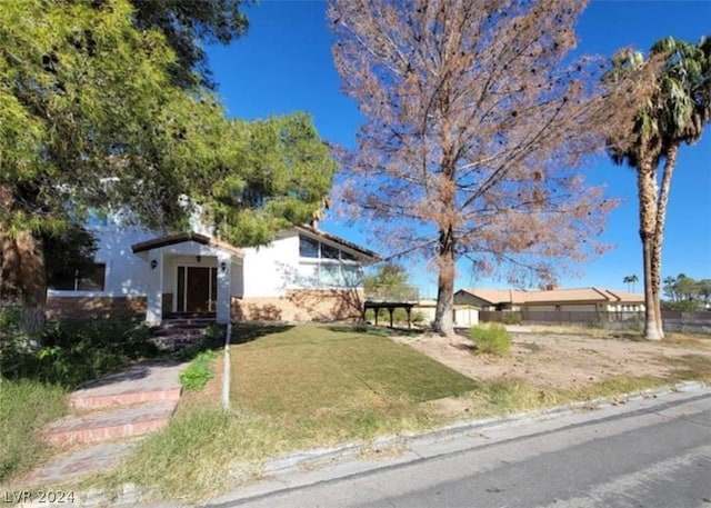 view of front of property with a front lawn