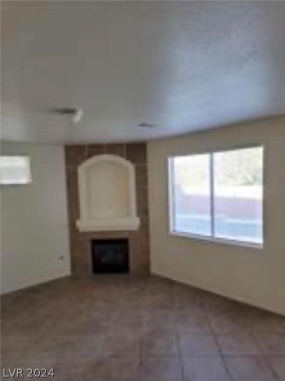 unfurnished living room with a fireplace