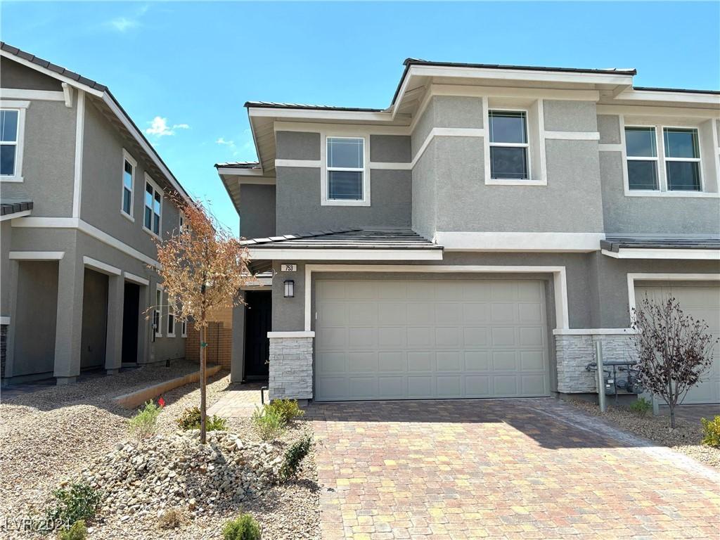 view of front of property featuring a garage