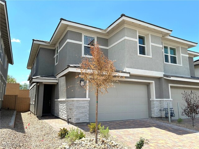 view of front of property with a garage