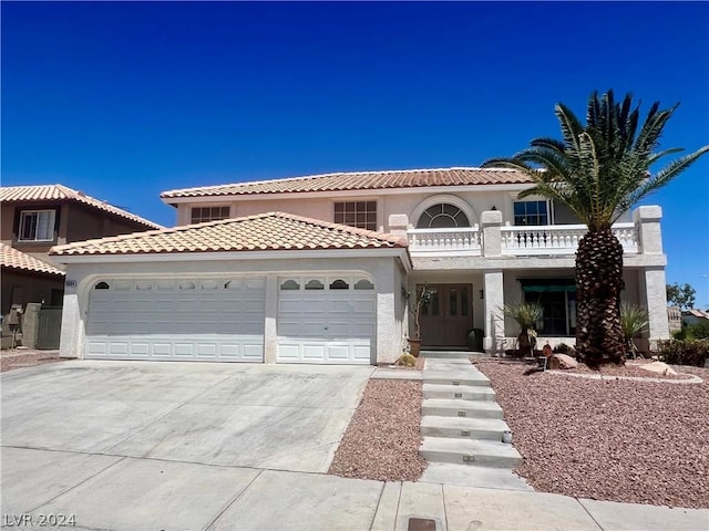 mediterranean / spanish house featuring a garage