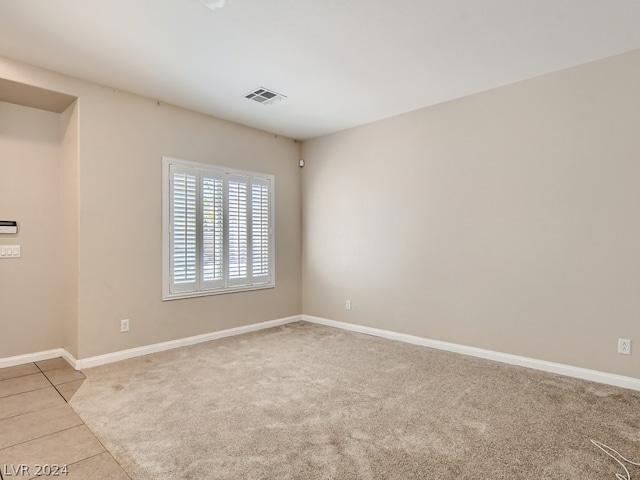 empty room featuring light tile flooring