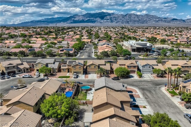 birds eye view of property with a mountain view