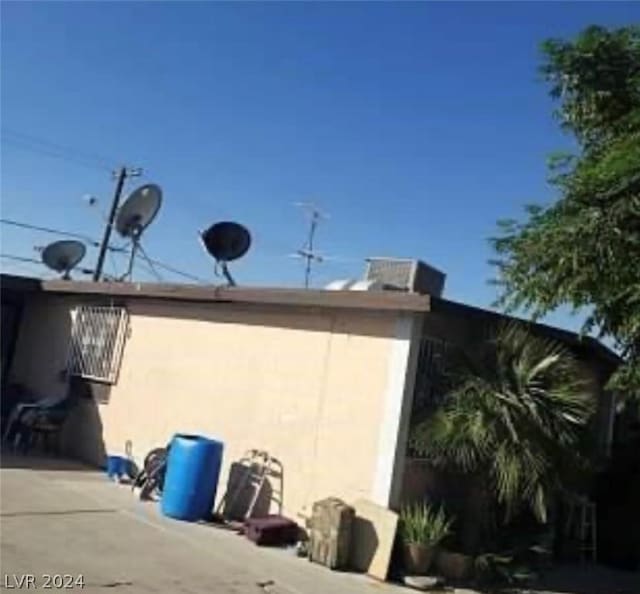 view of side of home with a patio area