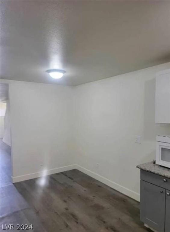 interior space with dark wood-type flooring