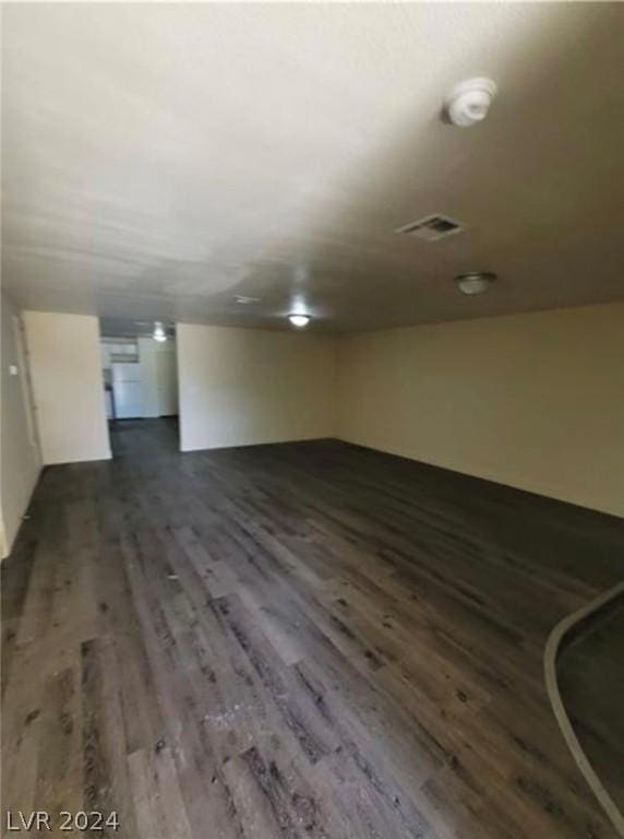 spare room featuring dark hardwood / wood-style flooring