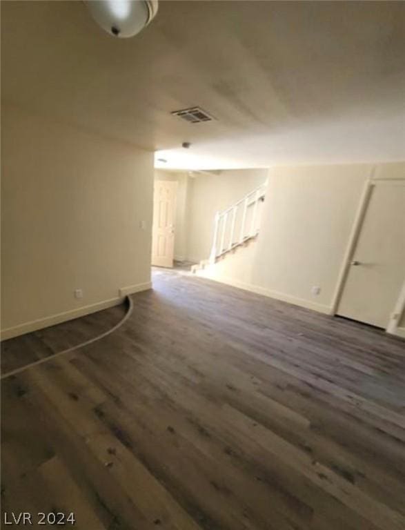 bonus room featuring dark wood-type flooring