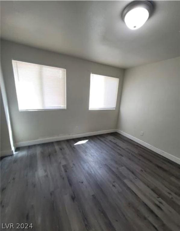 spare room featuring dark hardwood / wood-style floors