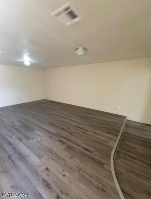 basement featuring dark hardwood / wood-style floors