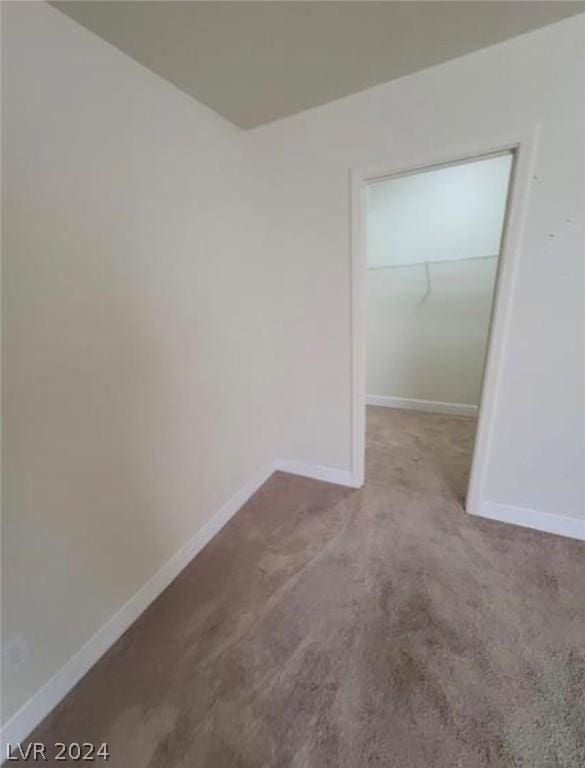 empty room featuring light colored carpet