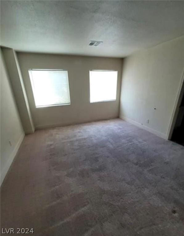 unfurnished room featuring carpet floors