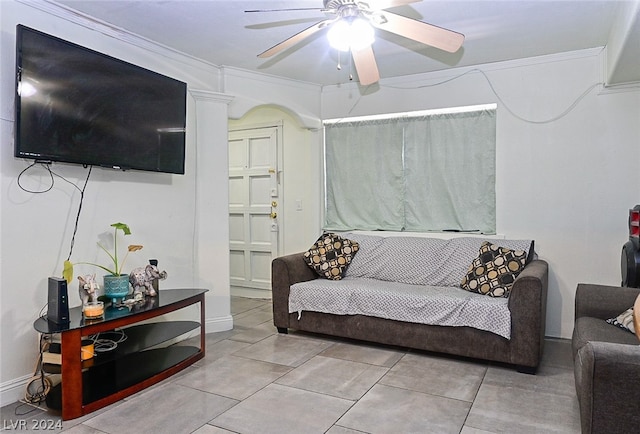 living room with ceiling fan and crown molding