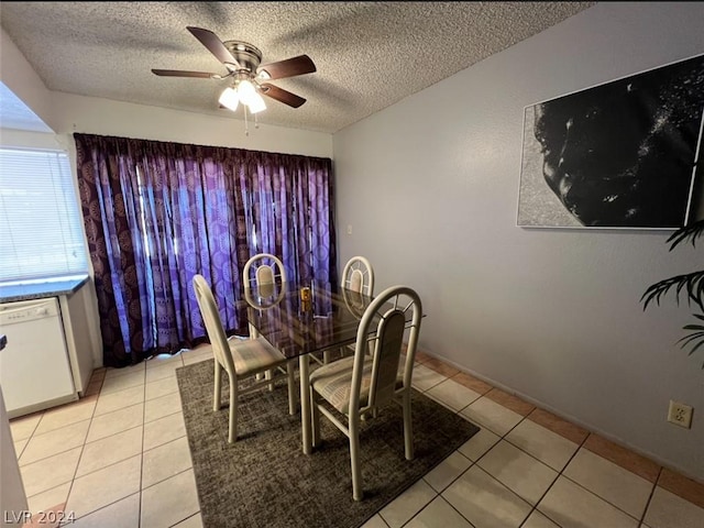 dining room featuring ceiling fan, light tile patterned flooring, and a textured ceiling