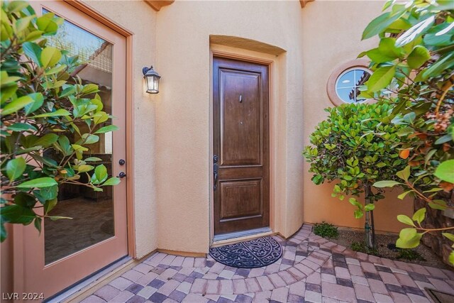 entrance to property with a patio area