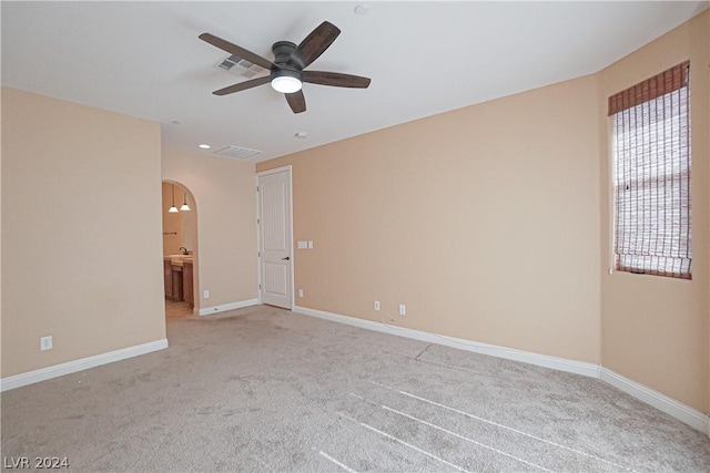 carpeted empty room with ceiling fan