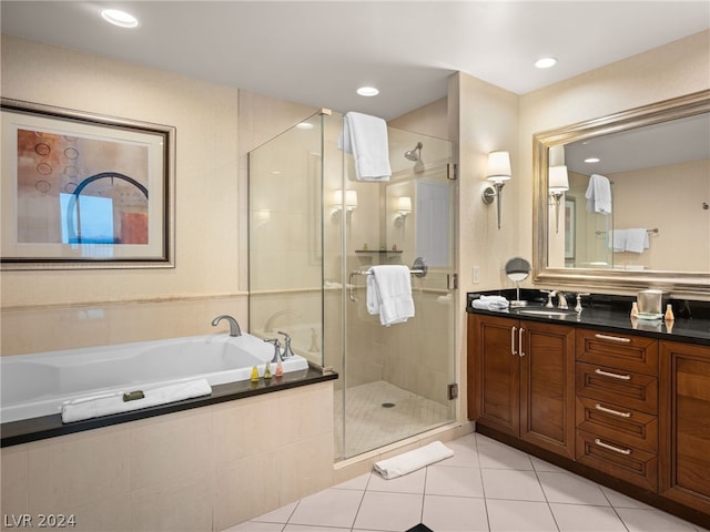 bathroom with vanity, independent shower and bath, and tile patterned flooring