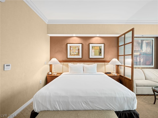 bedroom with crown molding and carpet flooring