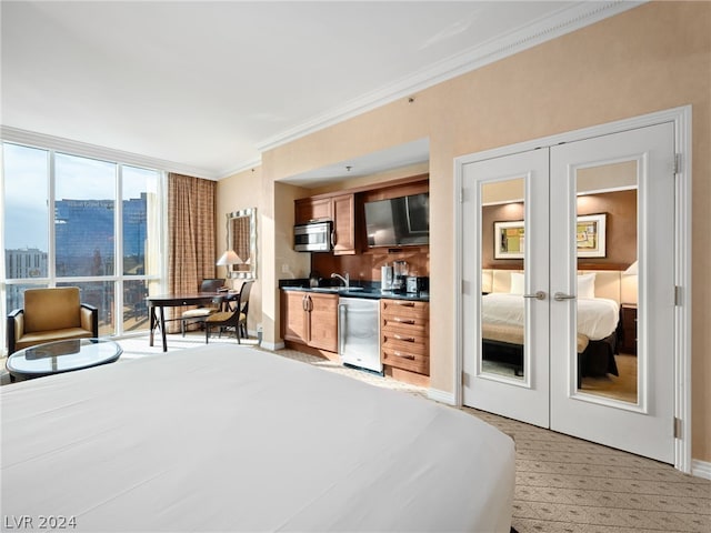 bedroom with french doors, ornamental molding, and a closet