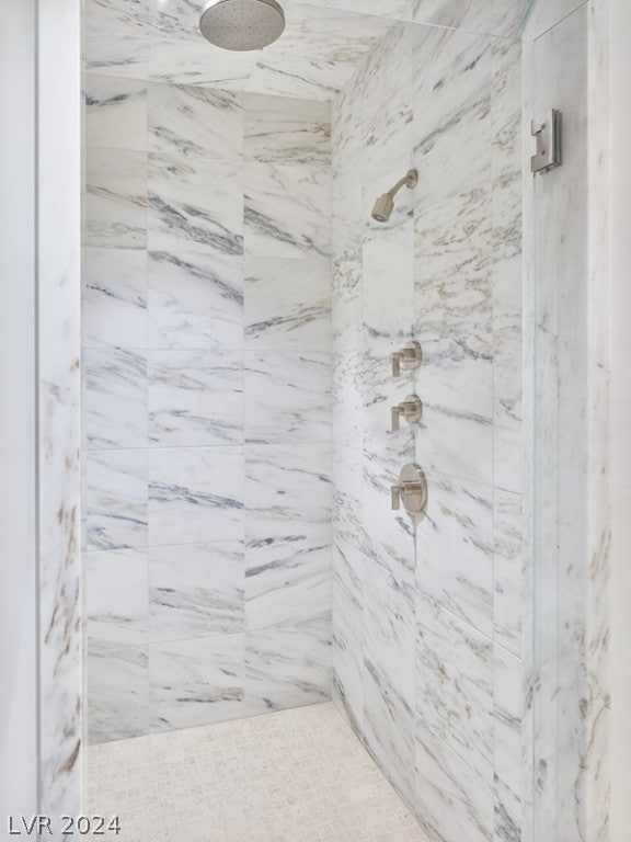 bathroom with a tile shower