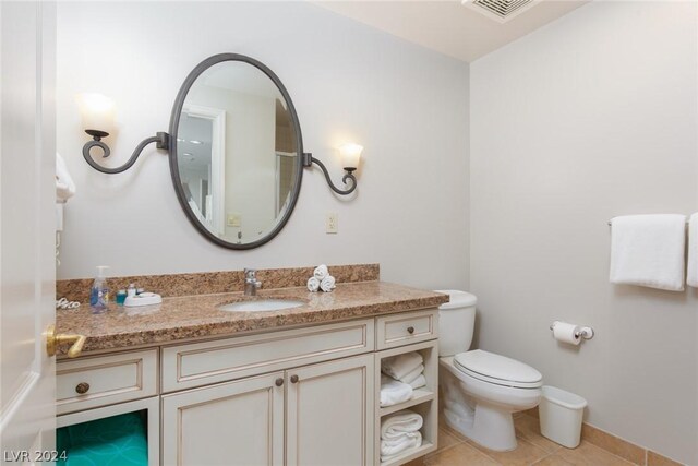 30 Strada Di Villaggio 248, Henderson, NV 89011 - bathroom with tile patterned floors, vanity, and toilet