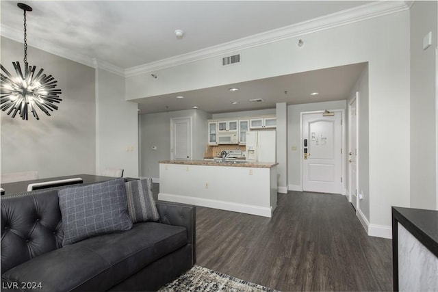 30 Strada Di Villaggio 248, Henderson, NV 89011 - living room with dark wood-type flooring, crown molding, sink, and an inviting chandelier