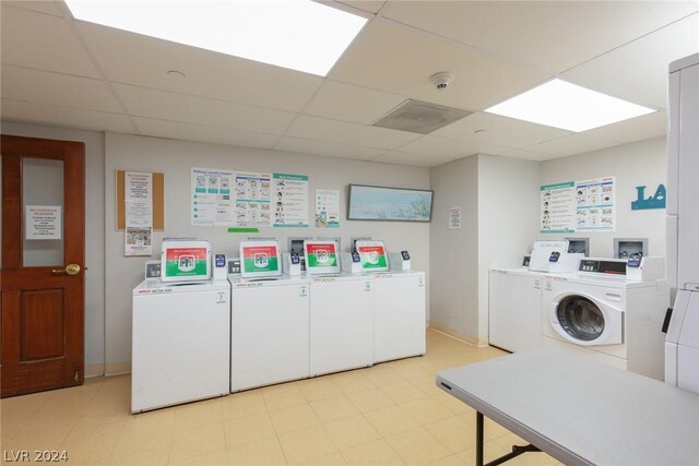 30 Strada Di Villaggio 248, Henderson, NV 89011 - laundry room featuring washing machine and clothes dryer and light tile patterned floors