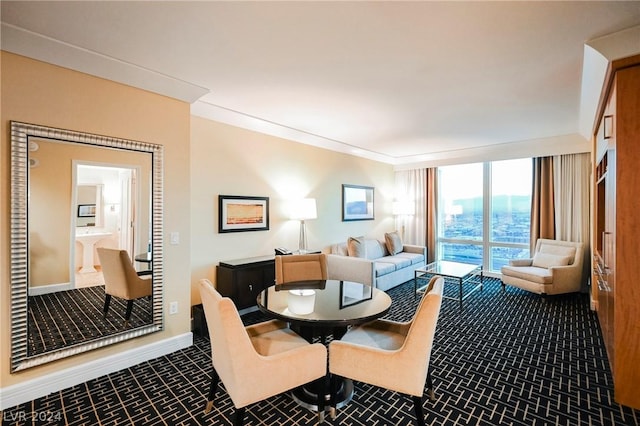 interior space with expansive windows and crown molding