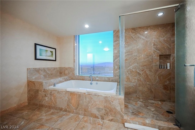 bathroom with separate shower and tub