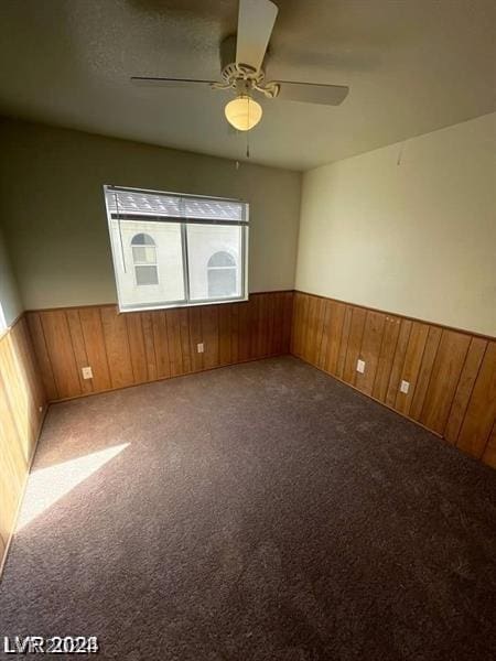 carpeted empty room with ceiling fan