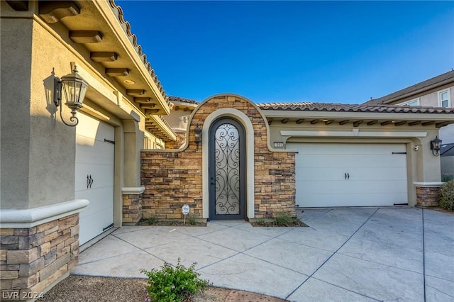 property entrance with a garage